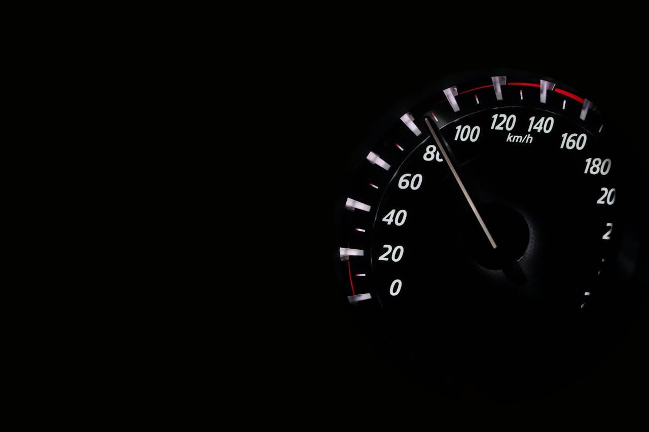 Speedometer reading showing speed in km/h on a dark background.